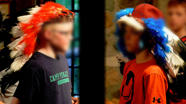Campers wearing headdresses at Camp Ponacka in 2014.