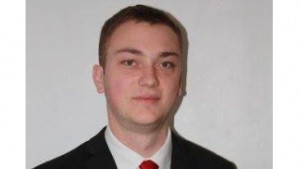 Electoral officer Matthew Swain is president of fraternity linked to opponent of disqualified VP candidate.