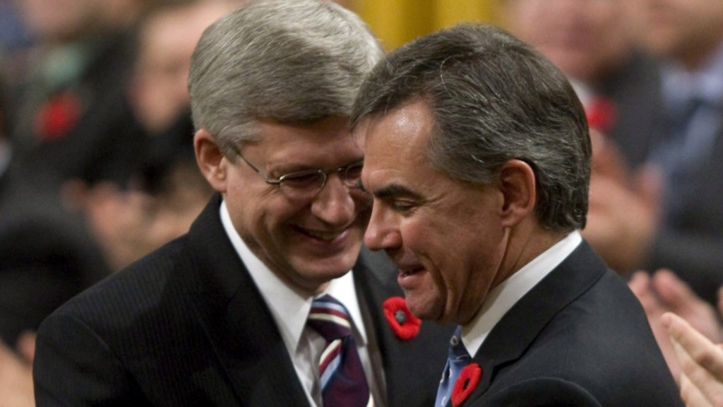 Jim Prentice with former prime minister Stephen Harper in the House of Commons. File photo